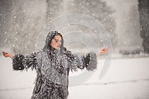 Winter portrait of Beauty girl with snow