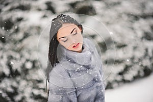 Winter portrait of Beauty girl with snow