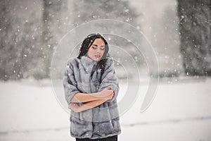 Winter portrait of Beauty girl with snow