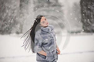 Winter portrait of Beauty girl with snow