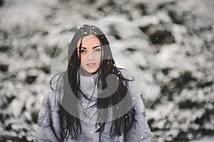 Winter portrait of Beauty girl with snow