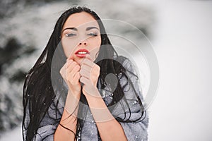 Winter portrait of Beauty girl with snow