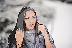Winter portrait of Beauty girl with snow