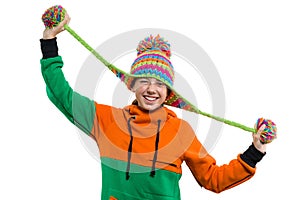 Winter portrait of funny teen girl in knitted hat, girl is having fun on white background, Isolated