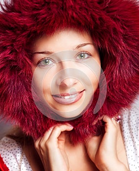Winter portrait of happy woman with fur hood