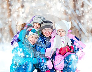 Winter portrait of happy young family