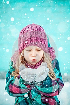 Winter portrait of a pretty little girl.