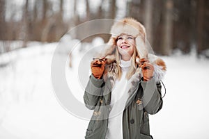 Winter portrait of woman in fur outdoors