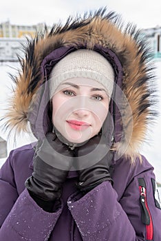 Winter portrait of young attractive woman