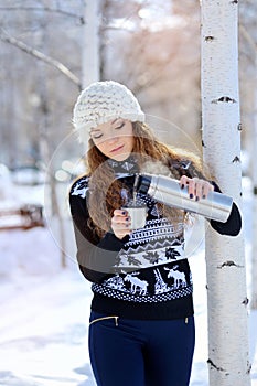 Winter portrait of young woman in fur hat