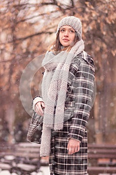 Winter portrait young woman standing outdoors
