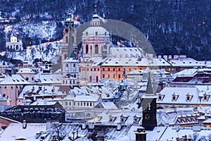 Winter in Prague - city panorama with St. Nicholas Church