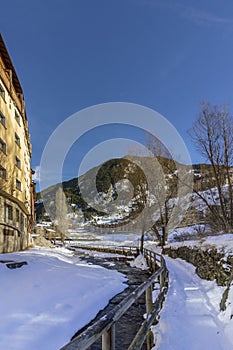 Winter pyrenes landscape near Village of Canillo, trekking and cycling trail.