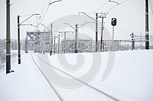 Winter railway landscape, Railway tracks in the snow-covered industrial country