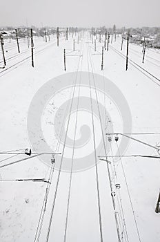 Winter railway landscape, Railway tracks in the snow-covered industrial country