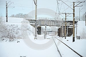 Winter railway landscape, Railway tracks in the snow-covered industrial country