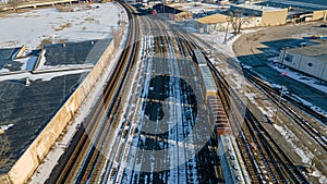 Winter railyard with snow during the day