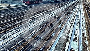 Winter railyard with snow during the day