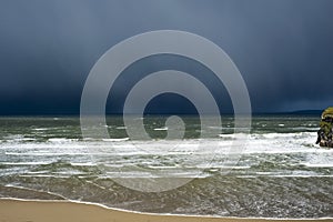 Winter rain storm approaching cliff