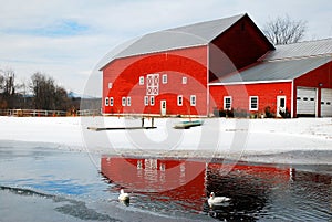 Winter Reflections of a red barn