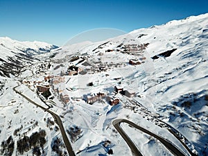 Winter resort valley drone view and road access