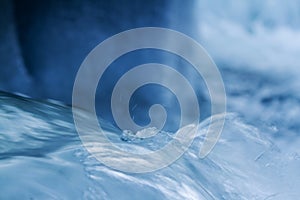 Winter river flow with ice close up