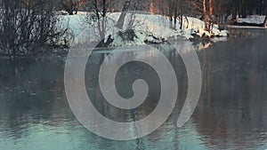 Winter river. Mist over river in winter park. Winter landscape. Misty river