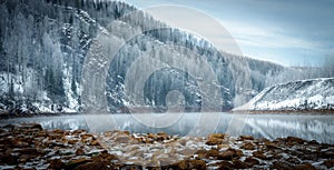 Winter riverside in the mountains