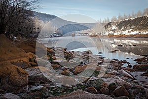 Winter riverside in the mountains