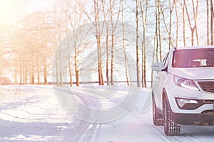 Winter road and a car