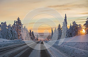 Winter road at sunset