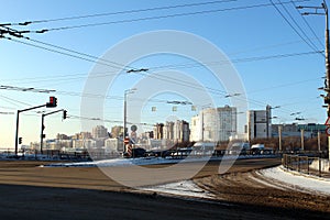 Winter road in a winter city on a sunny frosty day.