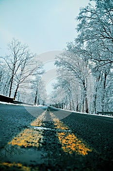 Winter road at yellow lines