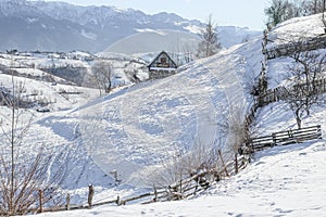 Winter in a Romanian mountain village with the Carpathians