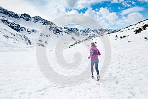 Winter running woman. Trail runner inspiration, sport and fitness