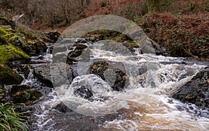 Winter runoff and fast turbulent water on a highland stream or burn in Scotland