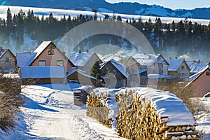 Winter rural landscape - mountain village covered with snow