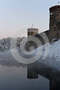 Winter\'s Embrace: Olavinlinna Castle in Snowy Splendor photo