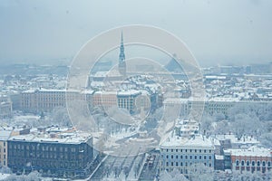 Winter's Serenity in Riga A SnowCovered Cityscape with Notable Landmarks.
