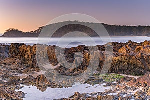 Winter`s Sunrise at Surf Beach with Craggy Rocks