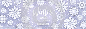 Winter sale.Snowfall frame with sale text and snow flakes on blue background for retail seasonal promotion. Christmas