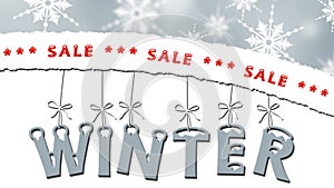 Winter sale - torn paper with text, letters hanging on tapes