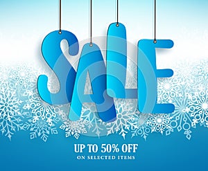 Winter sale vector banner design with hanging sale text in white winter snowflakes
