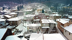 Winter scene on Bozdag mountain. Houses and streets are white with snow. Odemis, Izmir, Turkey