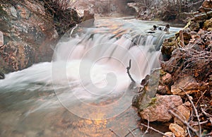 Winter scene with river in Tuhinj valley, Slolvenia photo