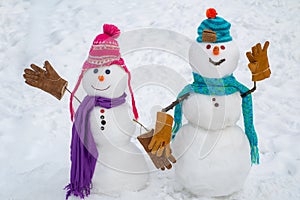 Winter scene with snowman on white snow background. Intimate moments for happy snowman lovers. Romantic portrait of a