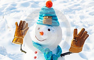 Winter scene with snowman on white snow background. New year concept. Winter background with snowflakes and snowman