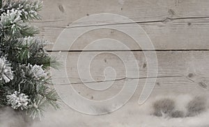 Winter scenery background, with sheepskin, snowy tree and weathered wood backdrop