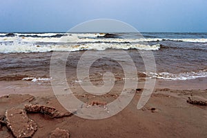 Winter sea with spume waves