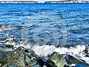 The winter sea wave beat against the rocks